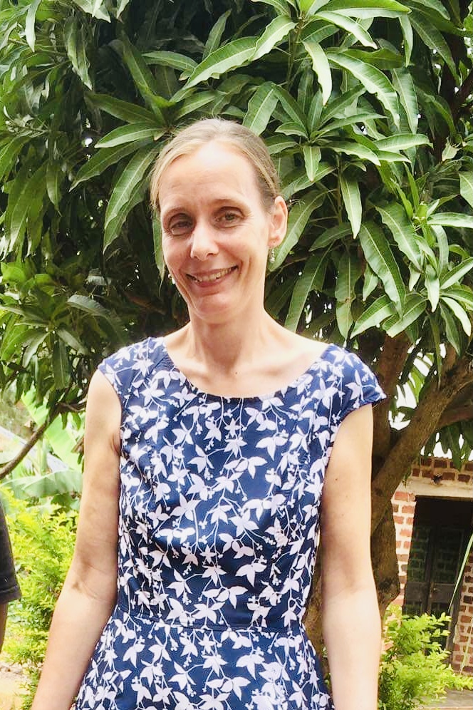 Christina under a mango tree in Uganda.